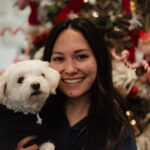 Dr. Kee smiling with her dog